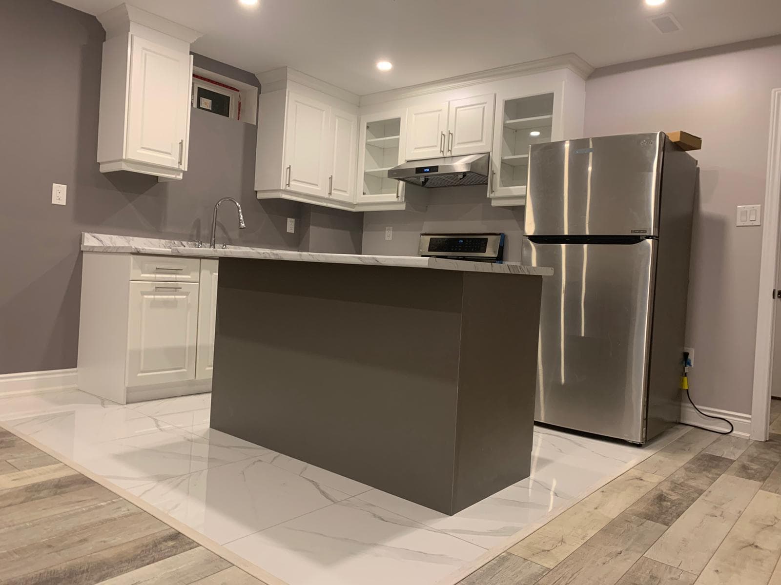 Basement Finishing Project in Toronto | Canvas Builds Finished Toronto basement with entertainment area and flooring