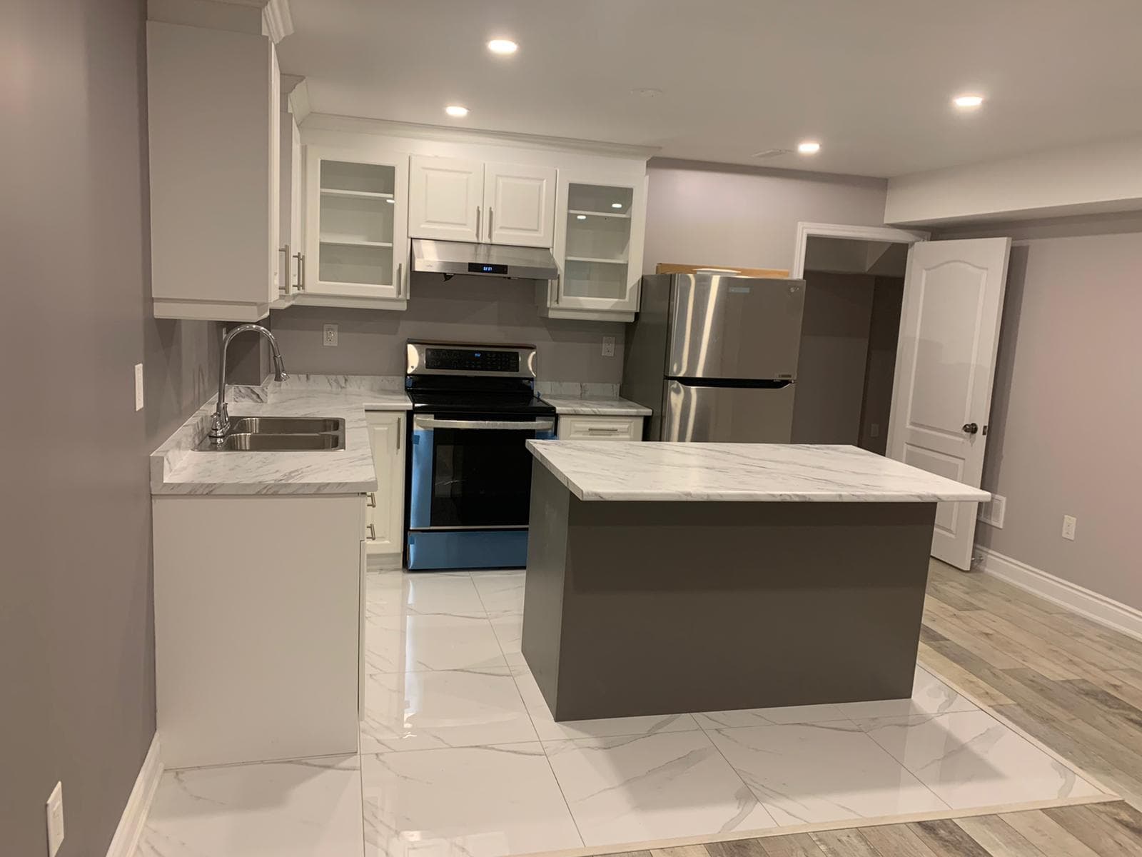 Kitchen Remodel Project in Toronto | Canvas Builds Modern Toronto kitchen with white cabinetry and countertops