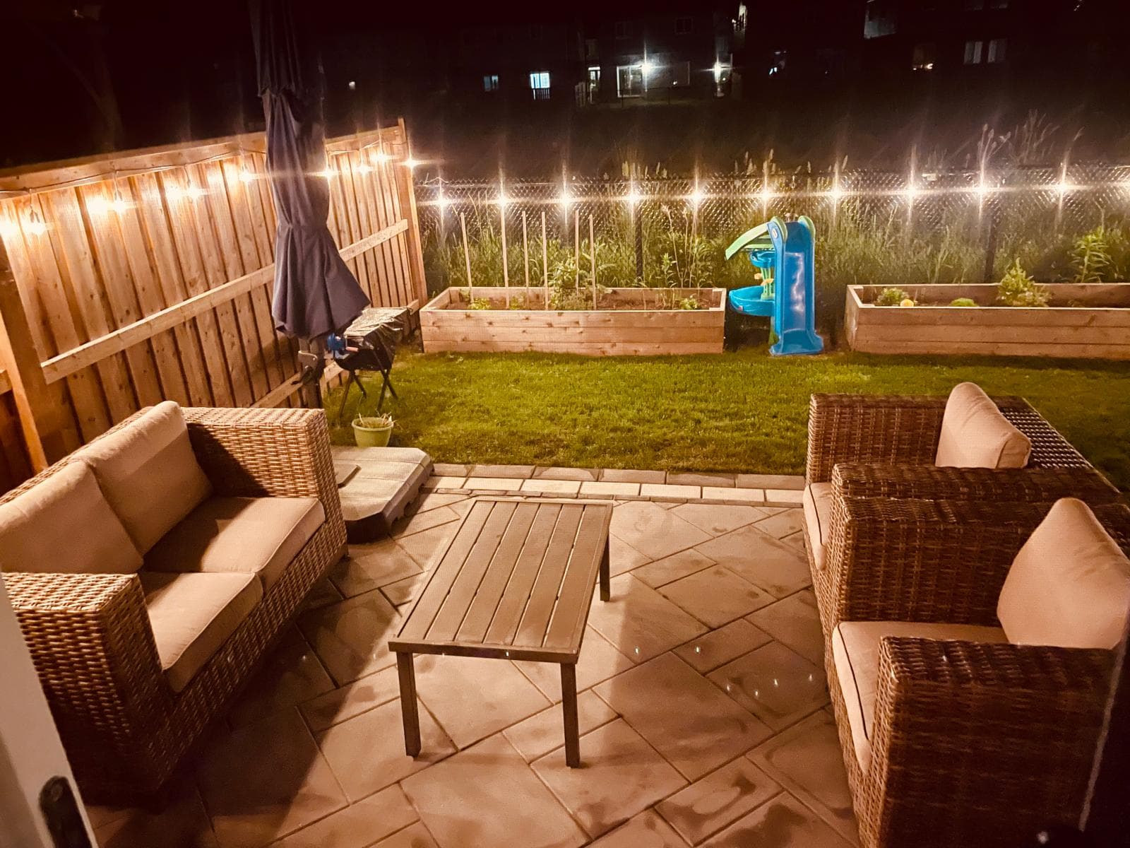 Modern backyard landscape with lush greenery and stone pathway