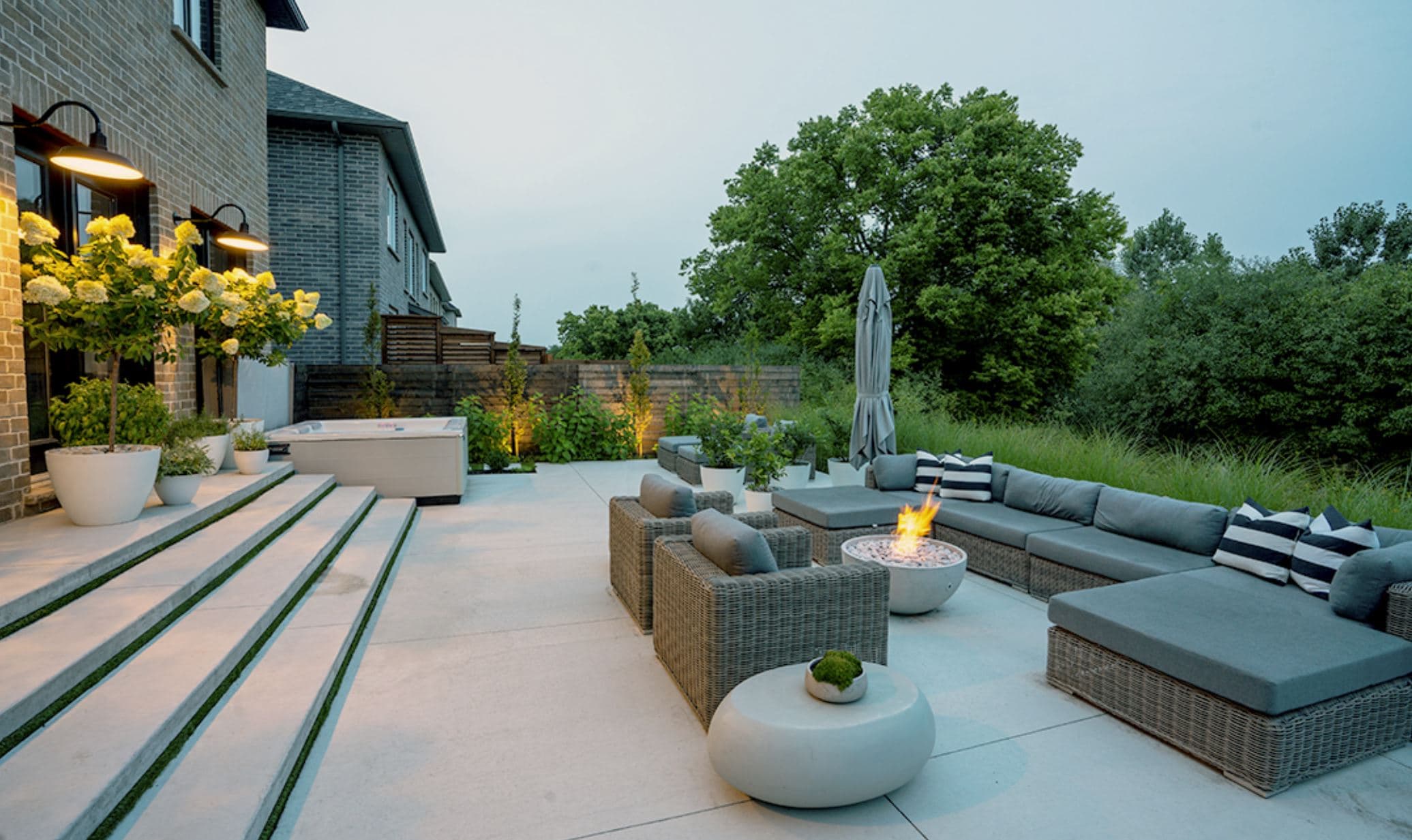 Luxury outdoor living space with custom landscaping and patio