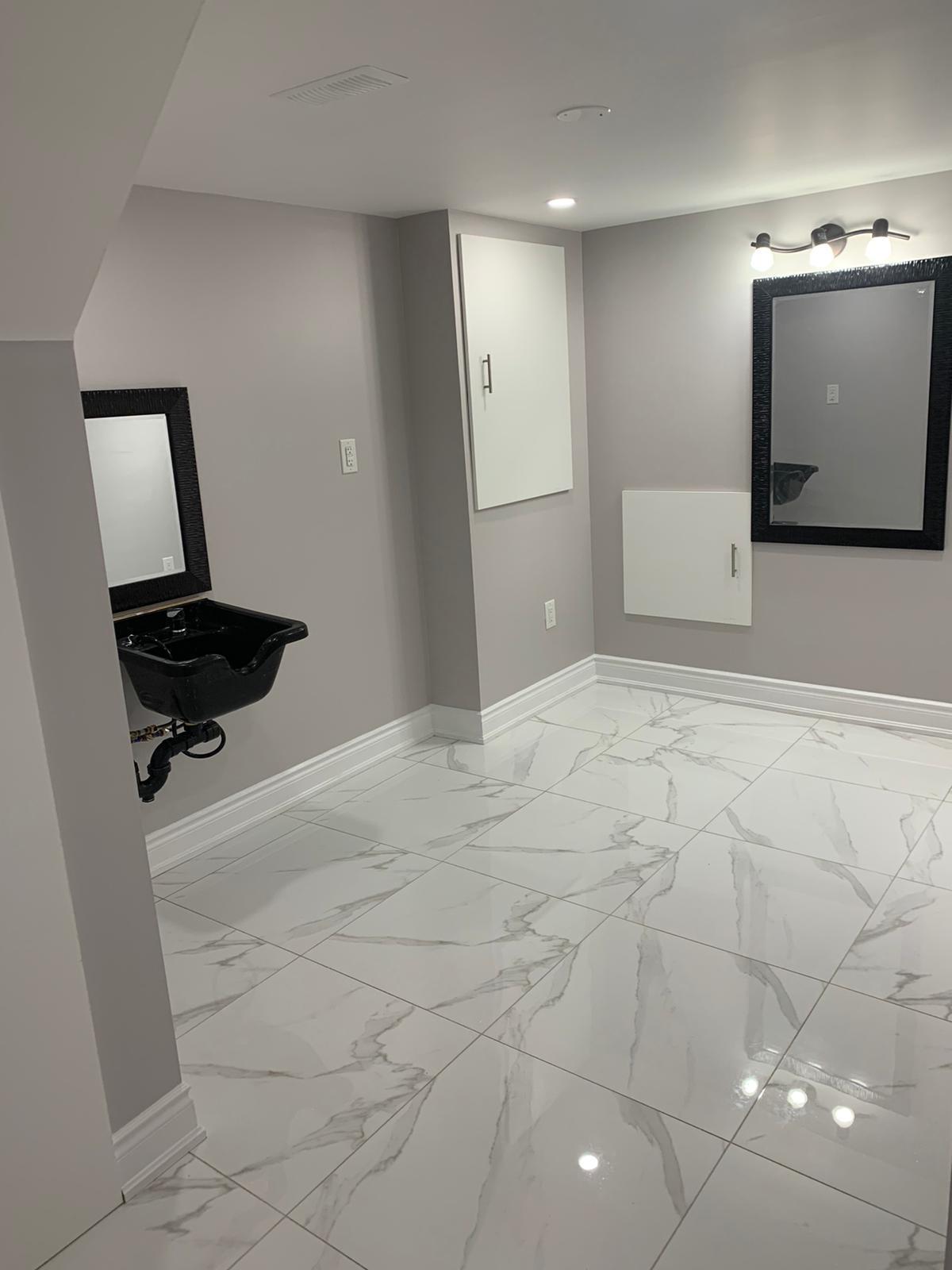 Toronto basement with custom tiles and painted walls in limited space