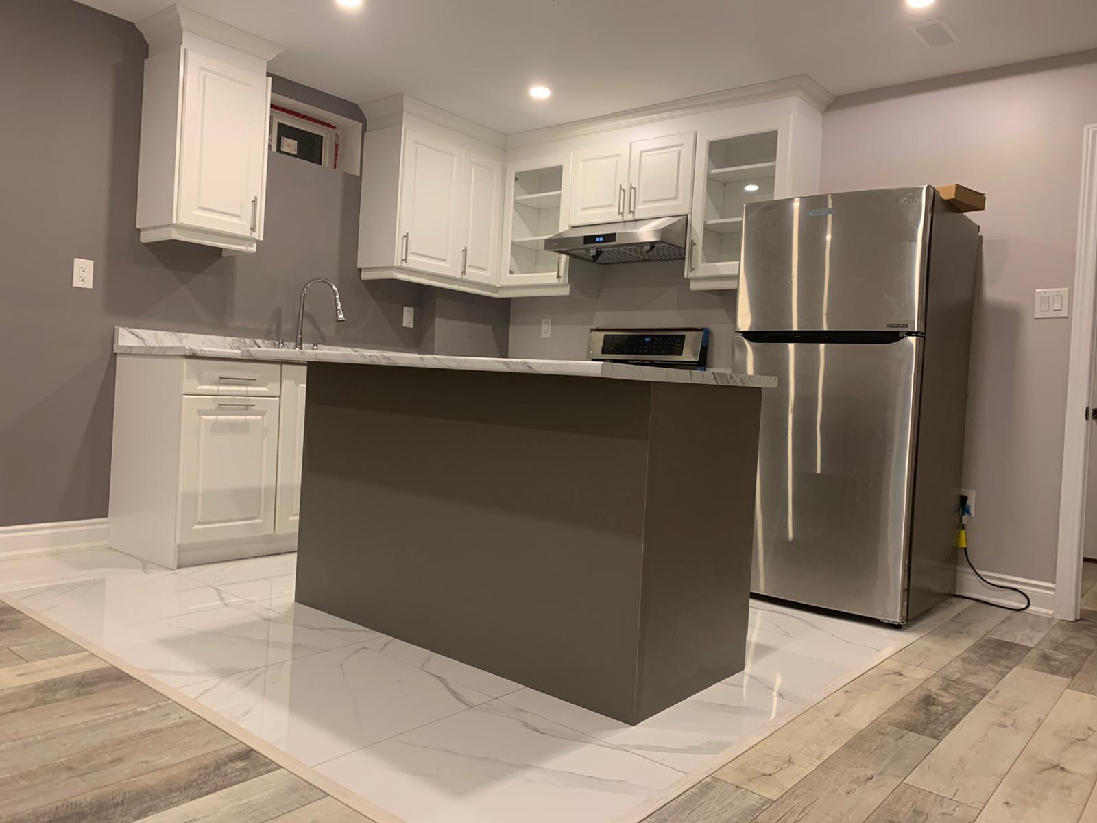 Open-concept kitchen with island and lighting in a Toronto home